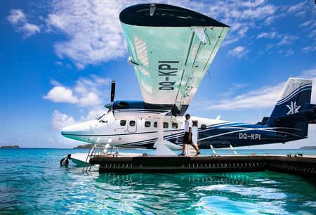 A modern seaplane docked at Kokomo Island Fiji’s welcome pier.
